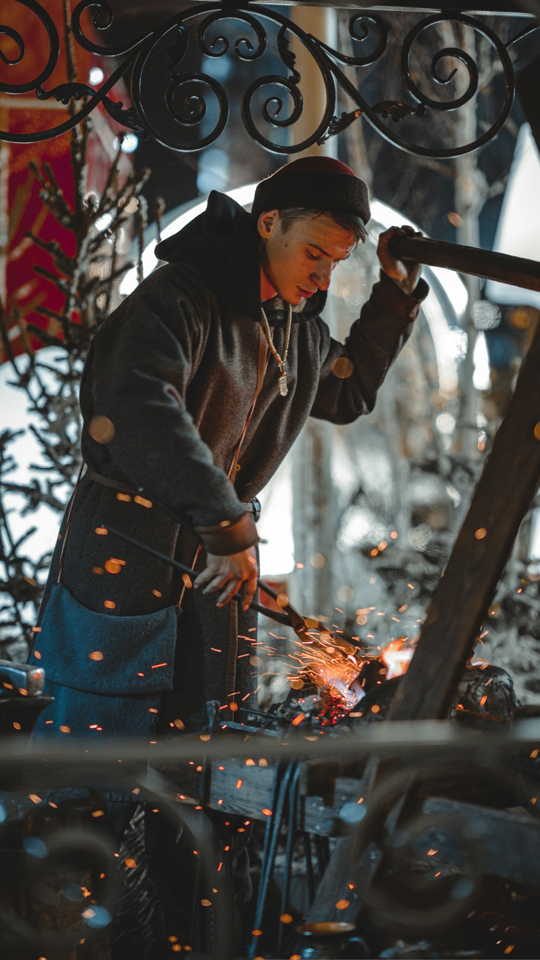 A blacksmith working at an anvil