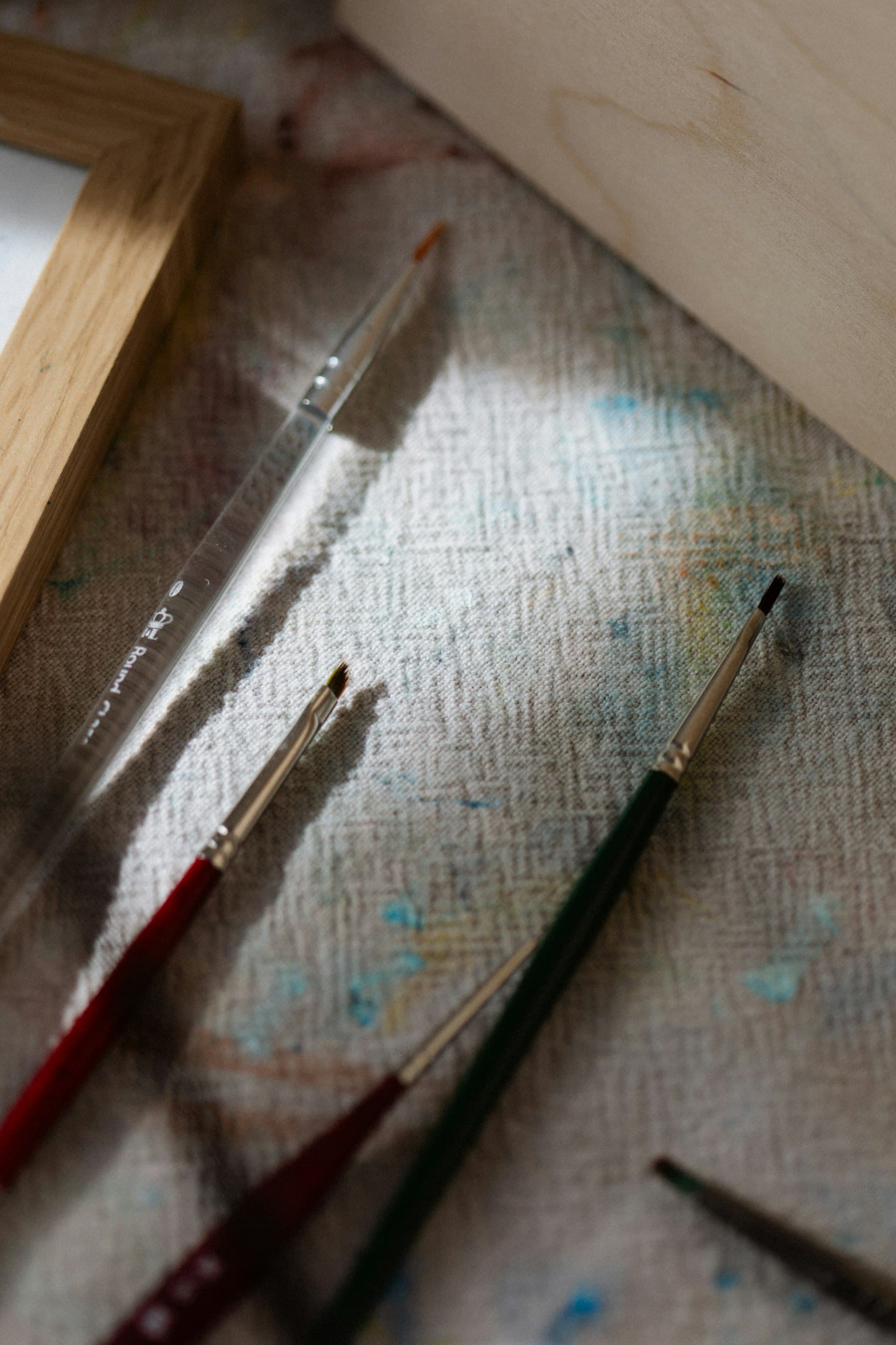 A sculptor's tools laid on a workbench