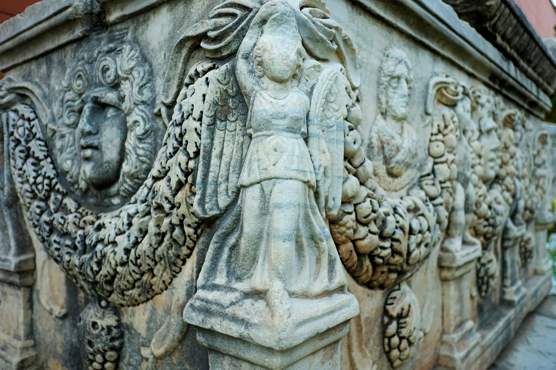 Carved marble relief of a winged figure